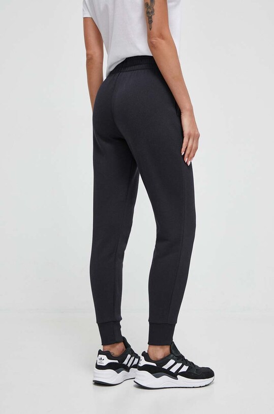 Odzież Under Armour spodnie dresowe 1379438 czarny