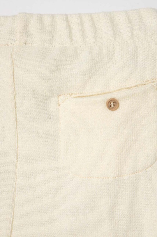 Chłopiec United Colors of Benetton spodnie dresowe niemowlęce 35MWAF01F.W.SEASONAL beżowy