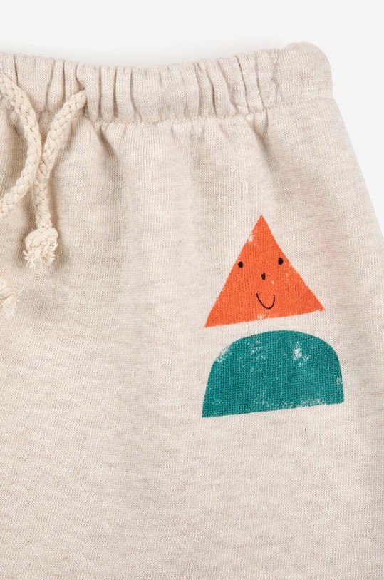 Bobo Choses spodnie dresowe bawełniane niemowlęce beżowy 223AB067