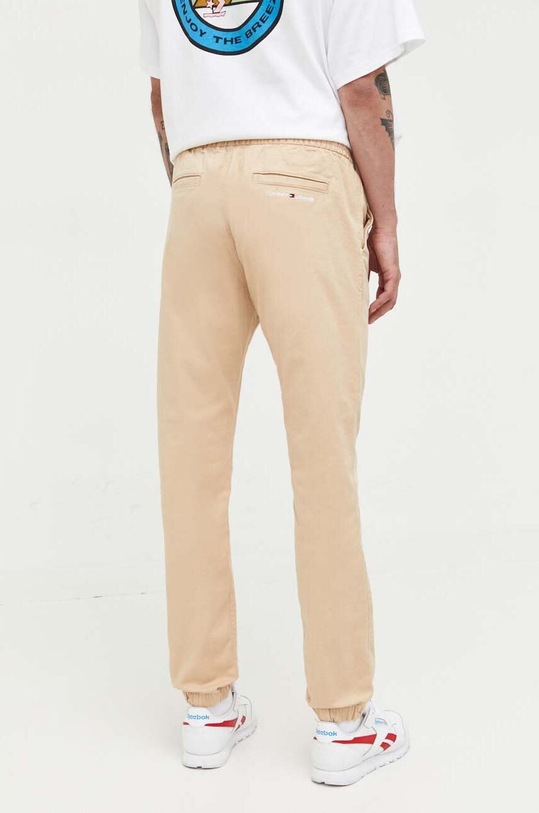 Odzież Tommy Jeans spodnie DM0DM16760 beżowy