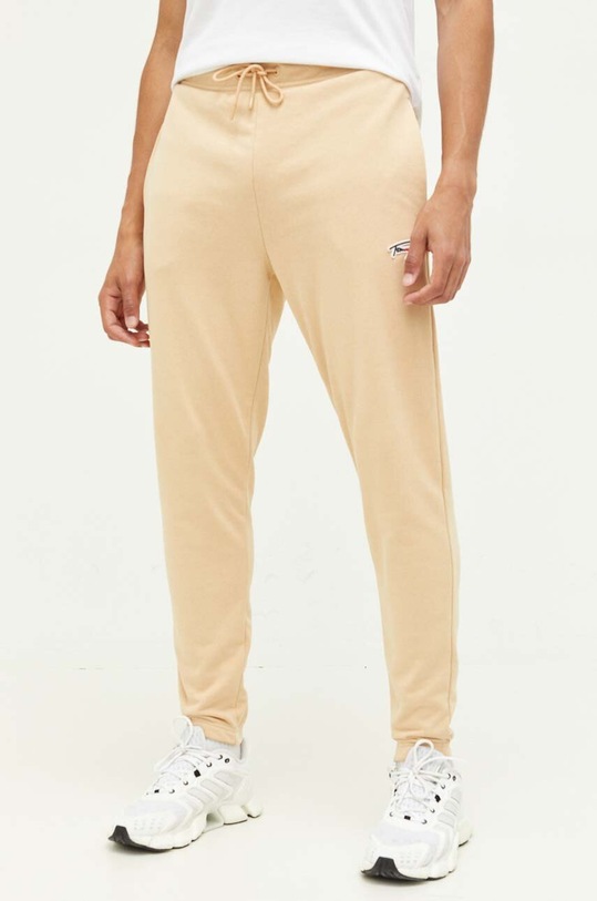 Tommy Jeans spodnie dresowe DM0DM16874 beżowy AW23