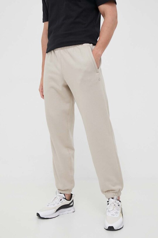 adidas Originals spodnie dresowe dzianina beżowy IM2127