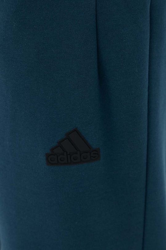 Tepláky adidas ZNE modrá IN5100
