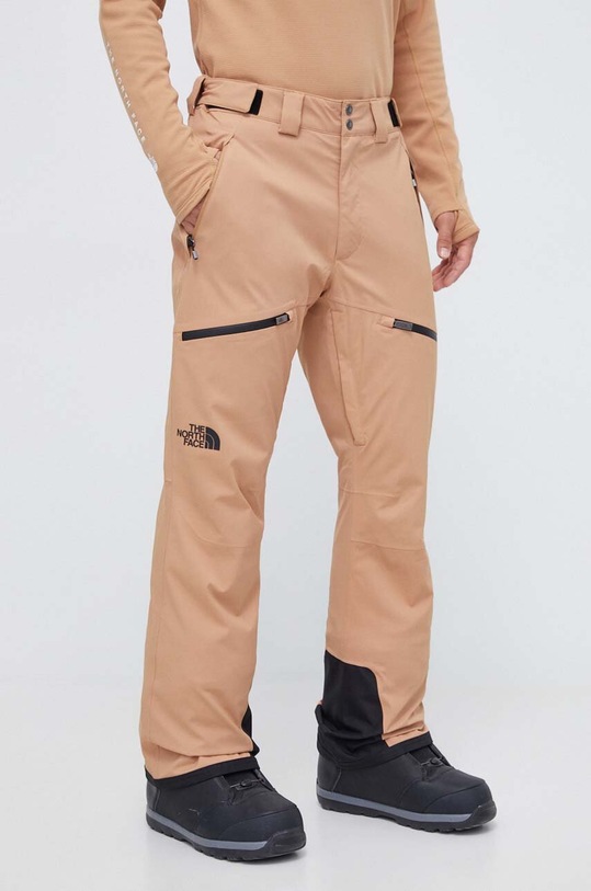 The North Face spodnie Chakal tkanina brązowy NF0A5IYVKOM1