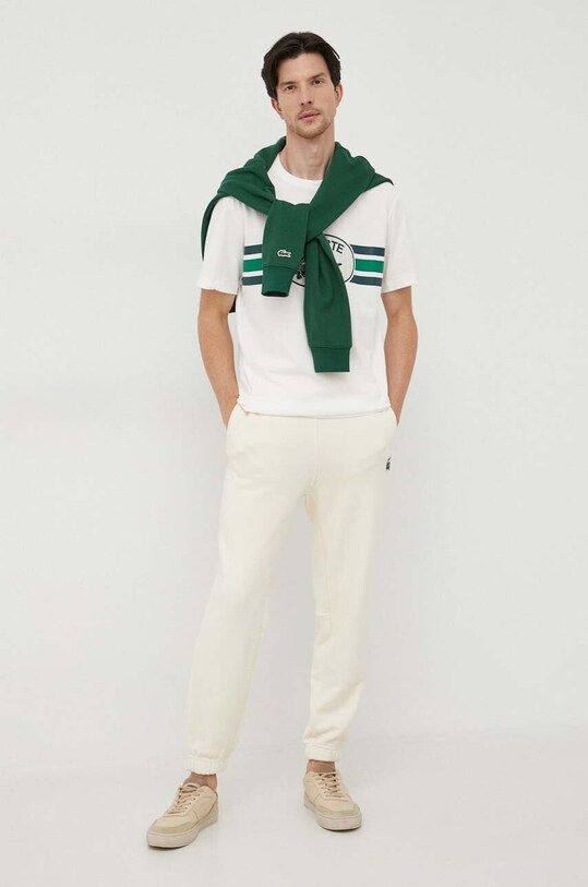 Lacoste spodnie dresowe bawełniane XH0075 beżowy SS24