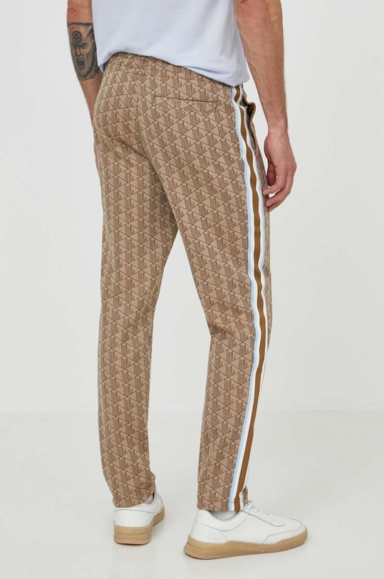 Odzież Lacoste spodnie dresowe XH1440 beżowy
