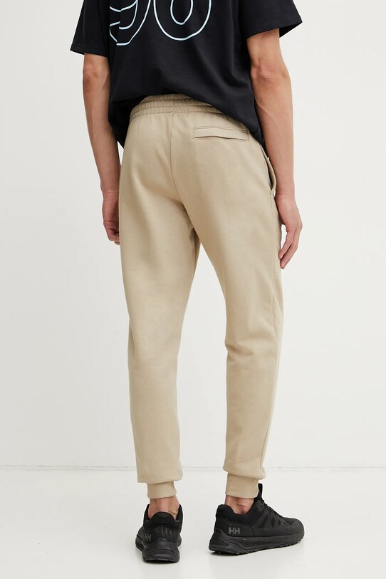 Oblačila Spodnji del trenirke Under Armour 1379774 zelena