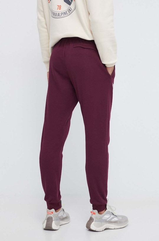 Odzież Under Armour spodnie dresowe 1379774 bordowy