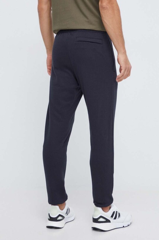 Odzież Under Armour spodnie dresowe 1379774 czarny