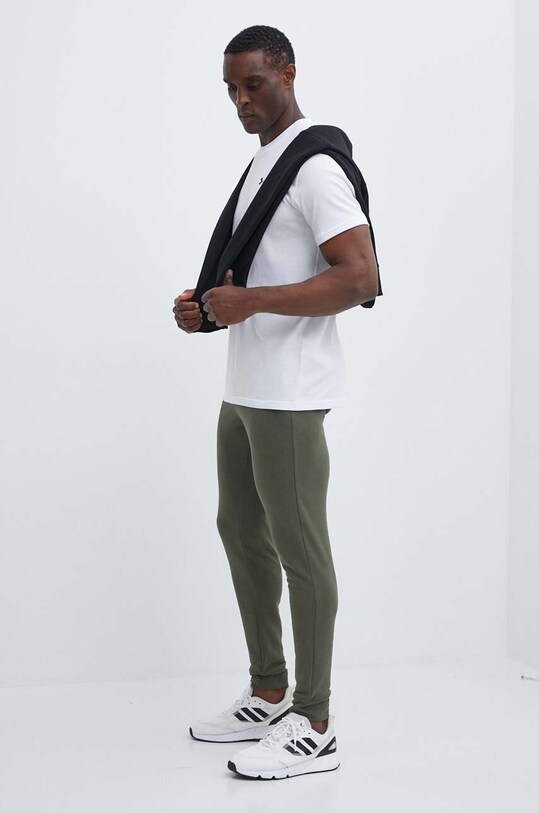 Under Armour spodnie dresowe 1380843 zielony AW24
