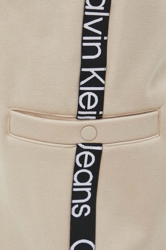 Calvin Klein Jeans spodnie dresowe beżowy J30J324376