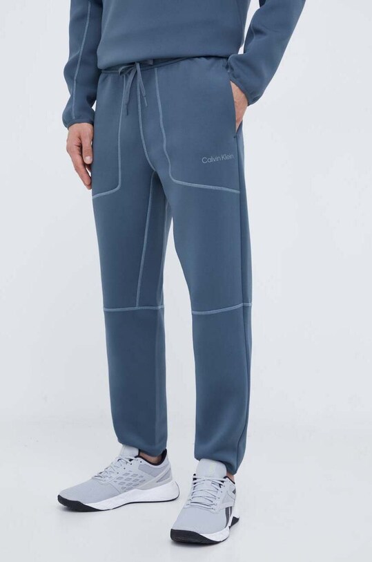 Ρούχα Παντελόνι προπόνησης Calvin Klein Performance 00GMF3P615 γκρί