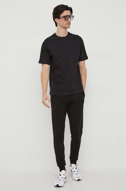 Tepláky Calvin Klein K10K111833 černá AW23