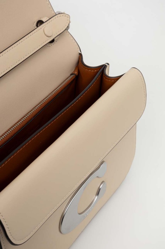 Kožená kabelka Coach CM557 béžová