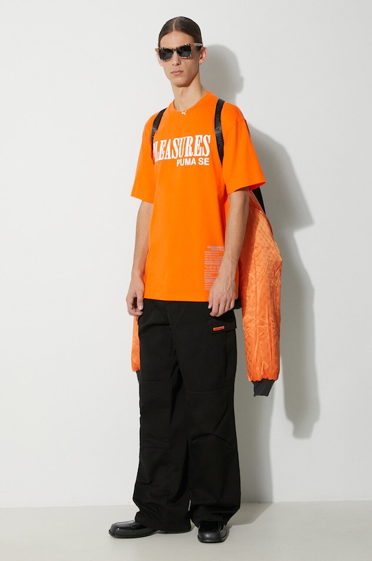 Puma t-shirt bawełniany PUMA x PLEASURES Typo Tee 620878 pomarańczowy AW23