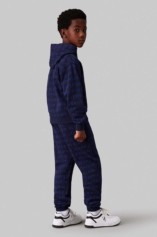 Dětská bavlněná mikina Calvin Klein Jeans námořnická modř IB0IB02322.128.176.9BYH
