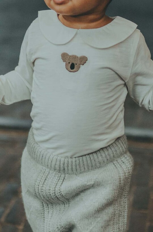 Donsje body din bumbac pentru bebelusi Davo Bodysuit Koala Produs pentru bebe alb 3030104.