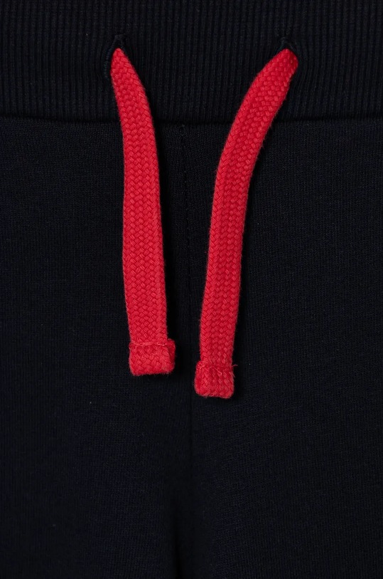 Dječja pamučna trenirka Guess crvena N4BG10.KAX73.9BYH