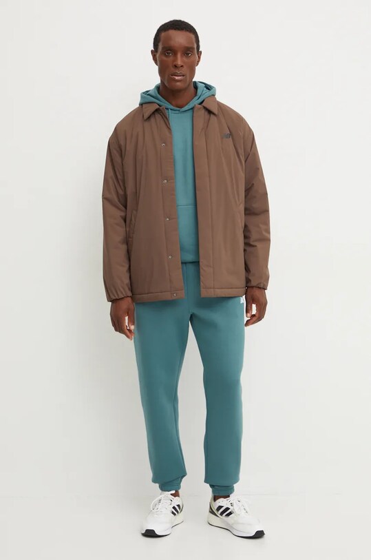 New Balance giacca MJ43504DUO marrone AW24