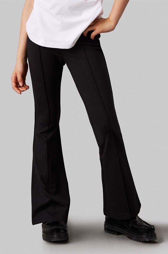 Calvin Klein Jeans legginsy dziecięce PUNTO TAPE FLARE czarny IG0IG02518.9BYH.104.116