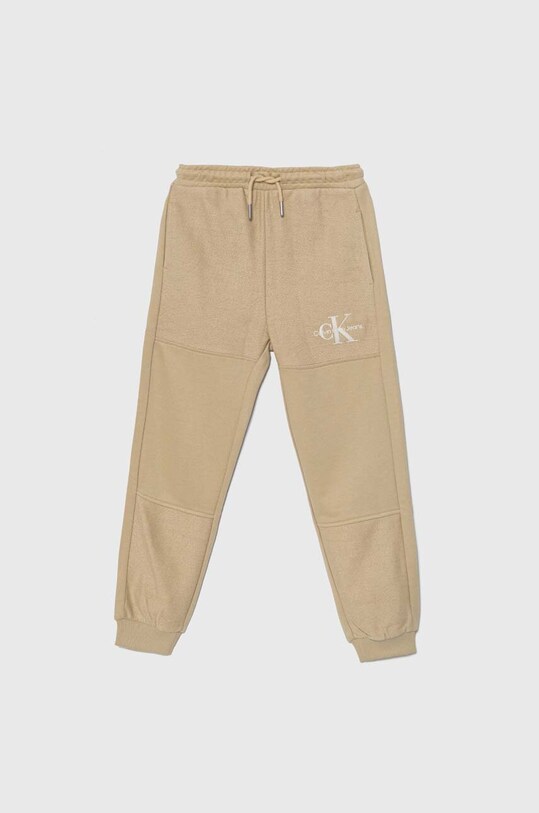 Дитячі спортивні штани Calvin Klein Jeans TERRY JOGGER трикотаж бежевий IB0IB02119.9BYH