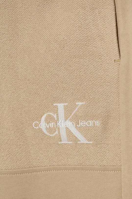 Хлопчик Дитячі спортивні штани Calvin Klein Jeans TERRY JOGGER IB0IB02119.9BYH бежевий