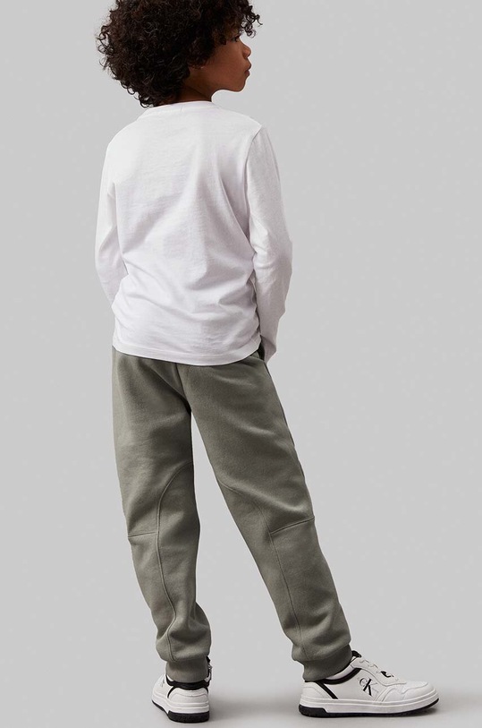 Detské tepláky Calvin Klein Jeans FLEECE JOGGER zelená IB0IB02123.9BYH