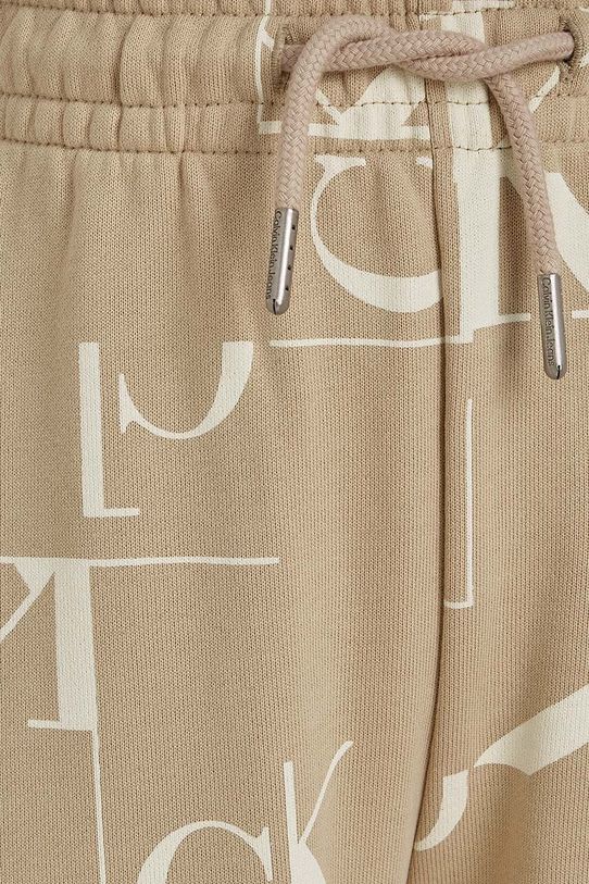 Calvin Klein Jeans spodnie dresowe bawełniane dziecięce TERRY JOGGER beżowy IB0IB02124.9BYH