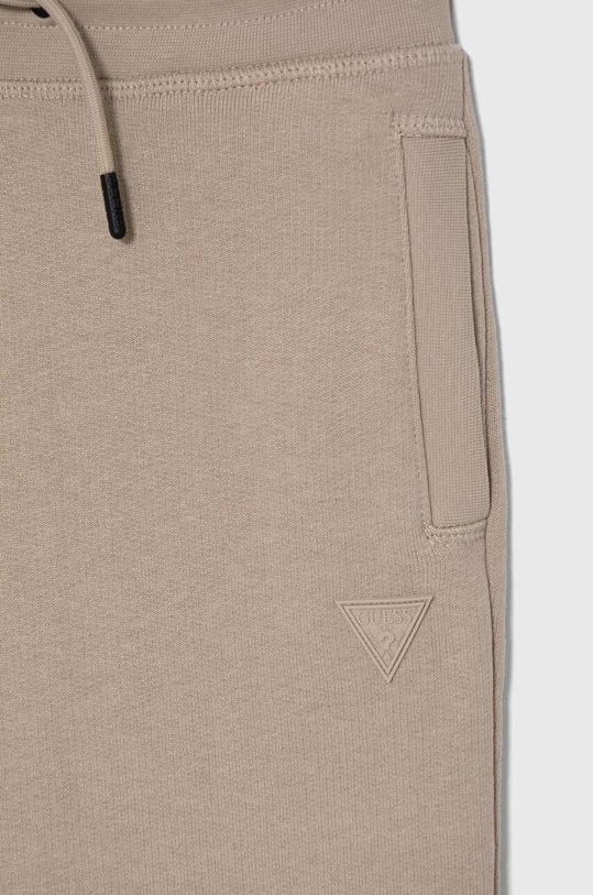 CHLAPEC Dětské tepláky Guess L2YQ46.KAIJ1.9BYH béžová