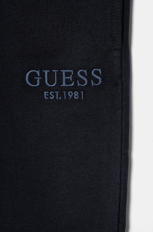 CHLAPEC Dětské bavlněné tepláky Guess L4BQ15.KAV33.9BYH námořnická modř