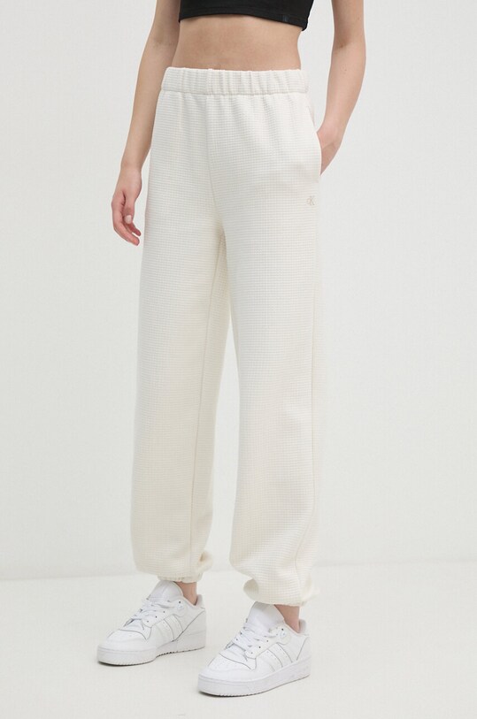 Calvin Klein Jeans spodnie dresowe z elastanem beżowy J20J223920
