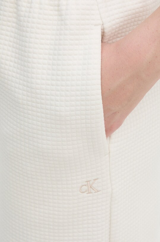 Calvin Klein Jeans spodnie dresowe beżowy J20J223920