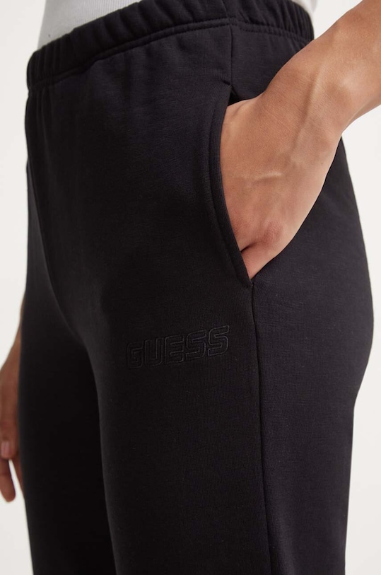 Bavlněné tepláky Guess RGINE černá V4YB11.KC6W1