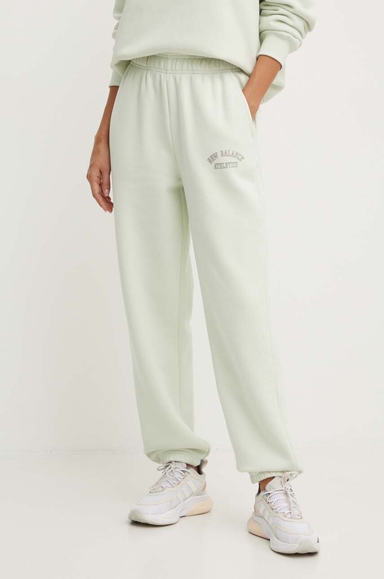 Tepláky New Balance WP43500NUM zelená AW24