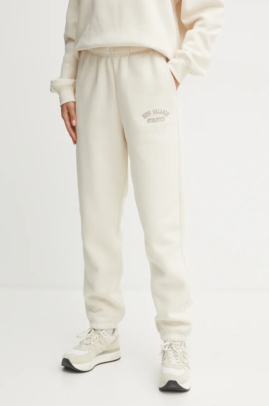 New Balance pantaloni de trening tricotaj bej WP43500LIN