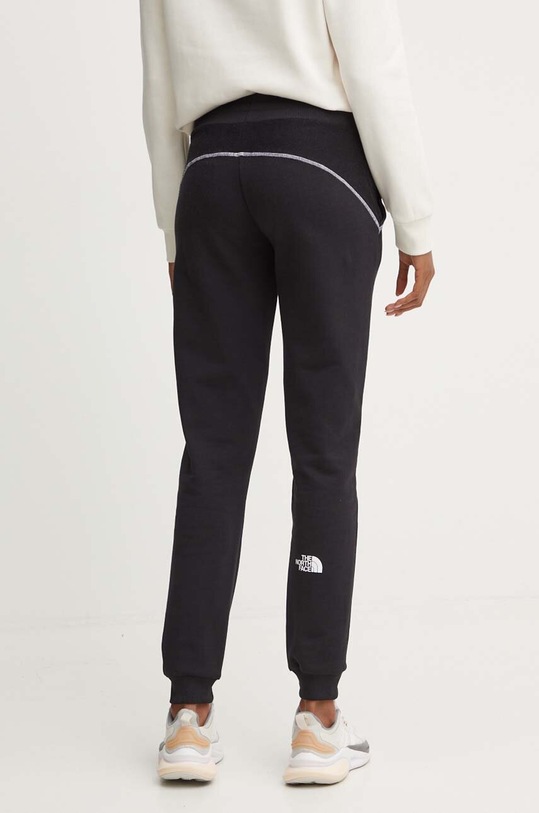 Odzież The North Face spodnie dresowe bawełniane Hakuun Jogger NF0A89CFJK31 czarny