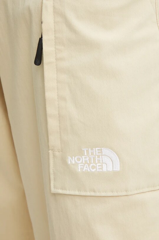 The North Face spodnie TNF x Yinka Ilori beżowy NF0A89GH3X41