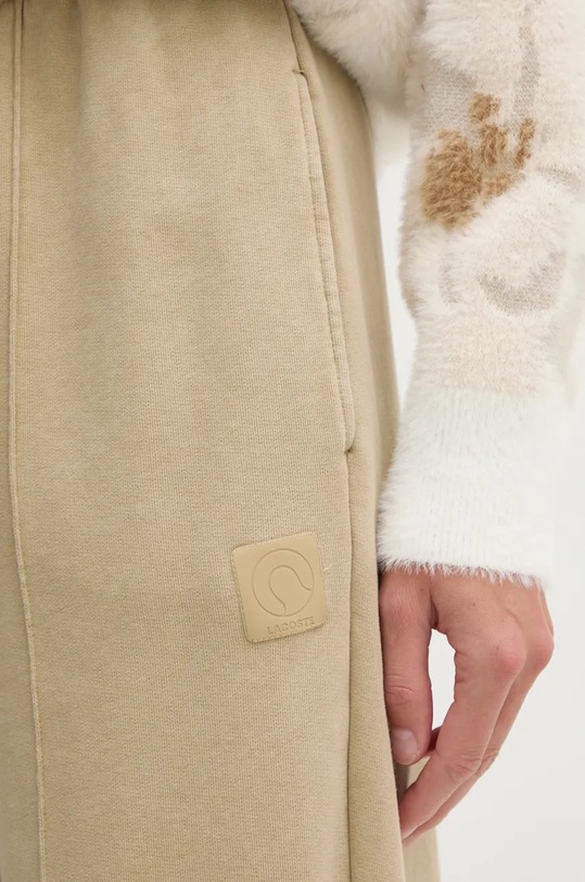 Бавовняні спортивні штани Lacoste бежевий XF2657