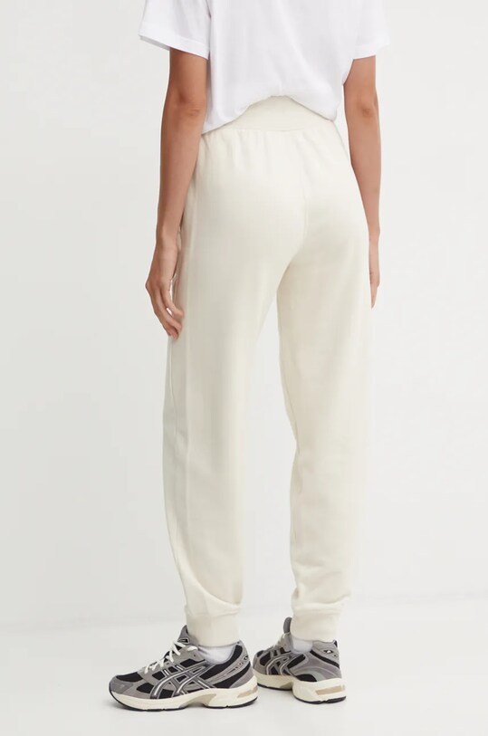 Asics spodnie dresowe 2032C844.200 beżowy SS25