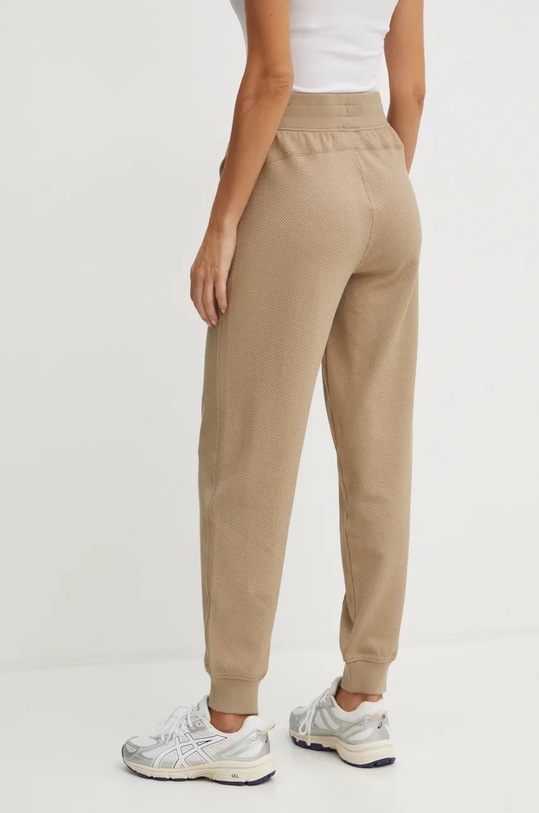 Odzież Puma spodnie 681634 beżowy