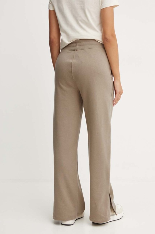 Odzież Puma spodnie dresowe bawełniane 682720 beżowy