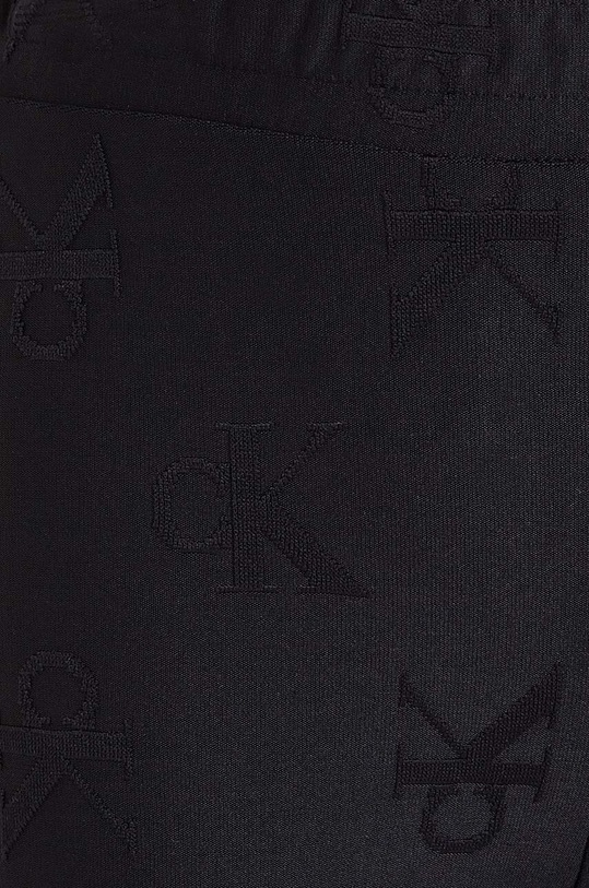 Dětské kalhoty Calvin Klein Jeans JACQUARD FLARE černá IG0IG02689.9BYH.128.176