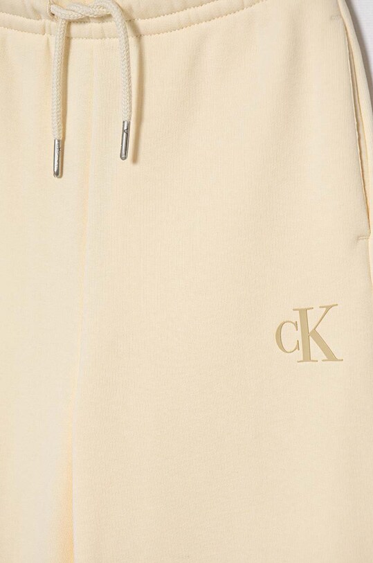 Dziewczynka Calvin Klein Jeans spodnie dresowe dziecięce IG0IG02174.9BYH. beżowy