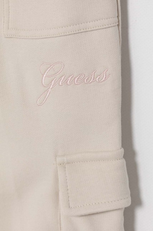 Dievča Detské bavlnené tepláky Guess J4YQ13.KA6R3.9BYH béžová