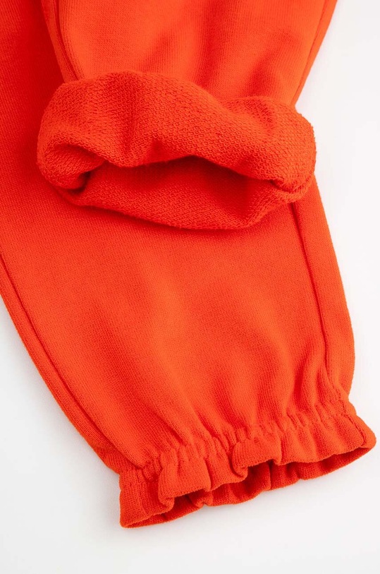 Detské bavlnené tepláky Coccodrillo ZC4120101CGN červená