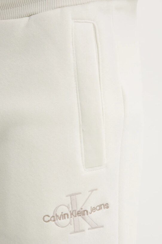 Tepláky Calvin Klein Jeans béžová J30J325658