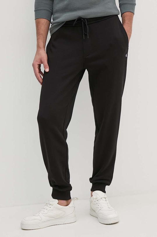 Παντελόνι φόρμας Calvin Klein Jeans πλεκτό ύφασμα μαύρο J30J326033