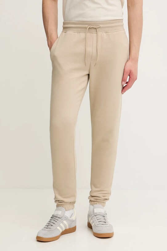 Спортивные штаны Tommy Jeans трикотаж бежевый DM0DM20473