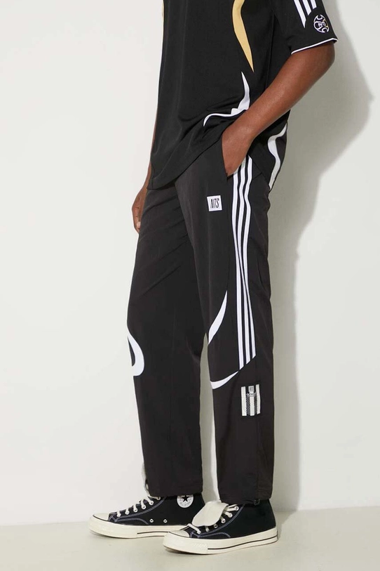 Donji dio trenirke adidas Originals adidas x NTS Radio Pant Planet friendly crna JI5065