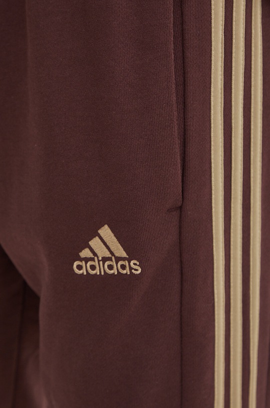 adidas spodnie dresowe bawełniane Essentials brązowy IW7681